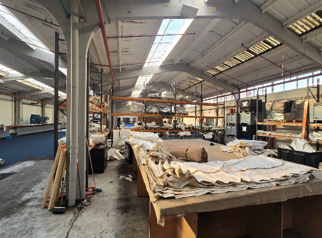 Fabrication workshop interior with skylights